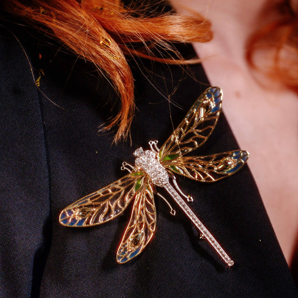Oversized dragonfly brooch styled on black outfit by Bill Skinner