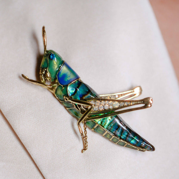 Grasshopper Brooch by Bill Skinner worn on a model, showing statement scale and colour.