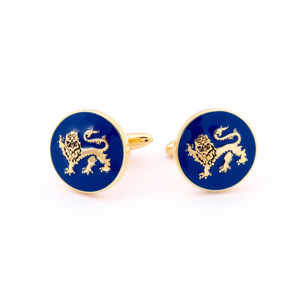 Close-up of Lion Passant Guardant Gold Cufflinks showing detailed lion design on blue enamel background.